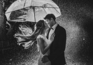 Couple under umbrella, happy, in love, tenderness, kiss, b / w Couple under umbrella, happy, in love, tenderness, kiss, b / w